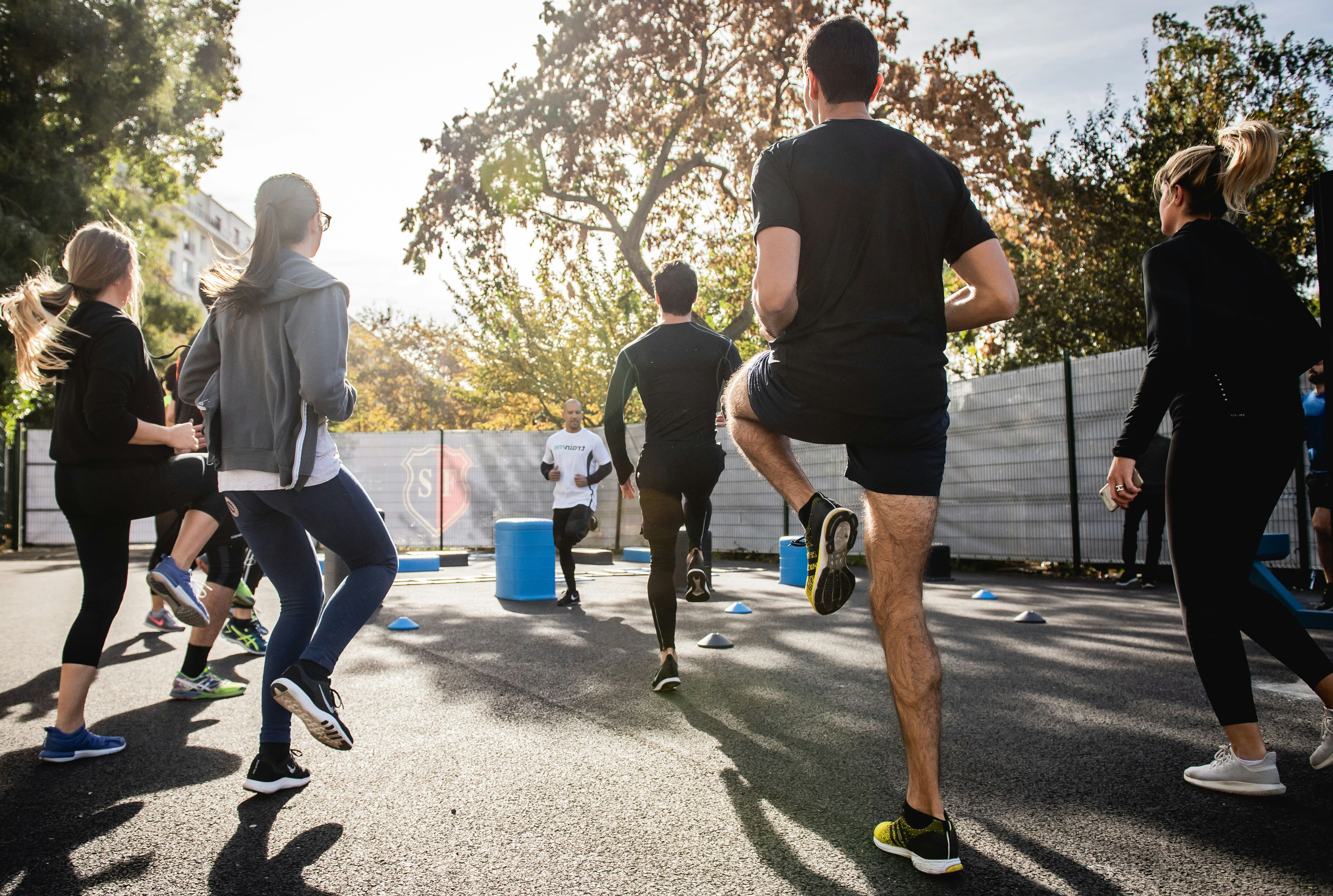 Group of people participating in outdoor exercise class